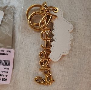 Burberry Doodle gold & white bag charm keyring